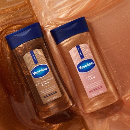 Two bottles of Vaseline lotion on a brown surface